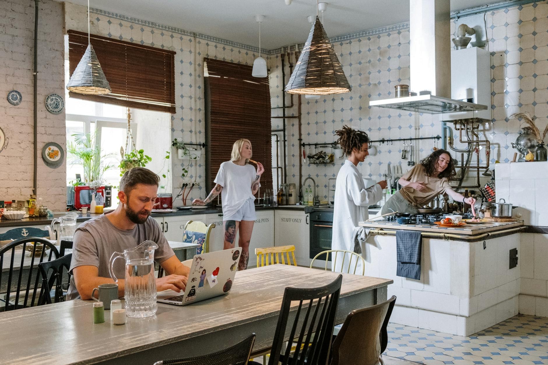 Community kitchen space in Galway with people cooking and sharing a meal